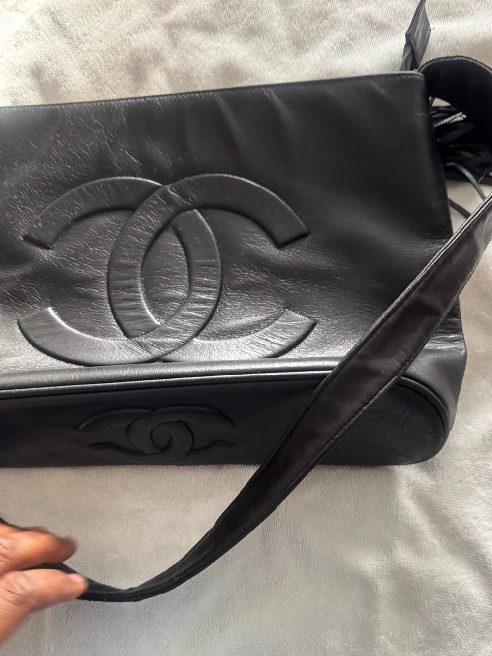 CHANEL Black Leather Messenger Bag with Embossed CC